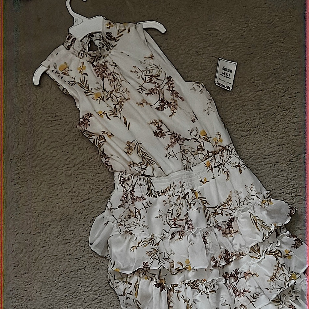 A nice floral turtleneck dress without sleeves/brand new and hasn’t been worn